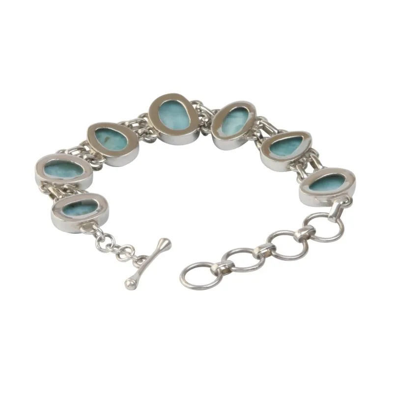 An Exquisite Double Linked Sterling Silver Bracelet with 7 unique shaped Larimar Crystals