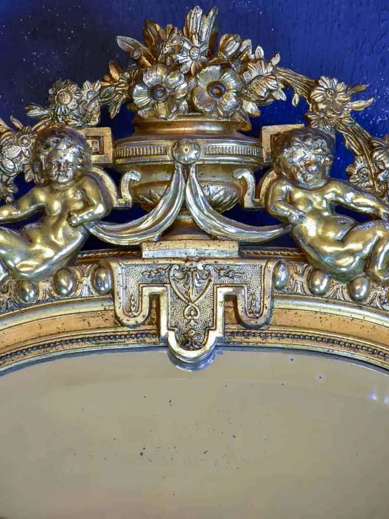 Gilded large Napoleon III mirror with elaborate crest and beveled glass 35½" x 70¾"