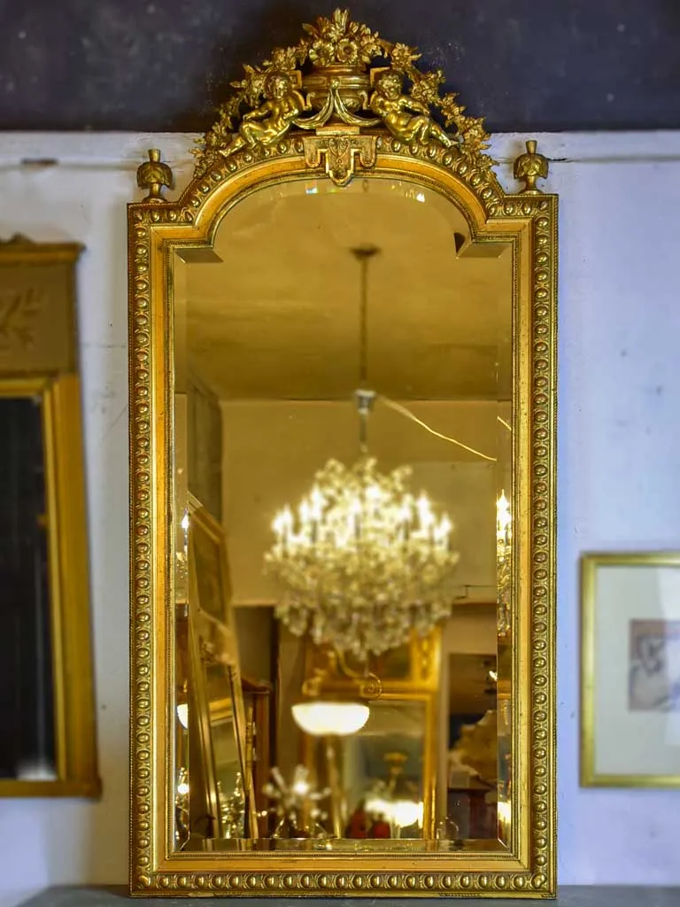 Gilded large Napoleon III mirror with elaborate crest and beveled glass 35½" x 70¾"