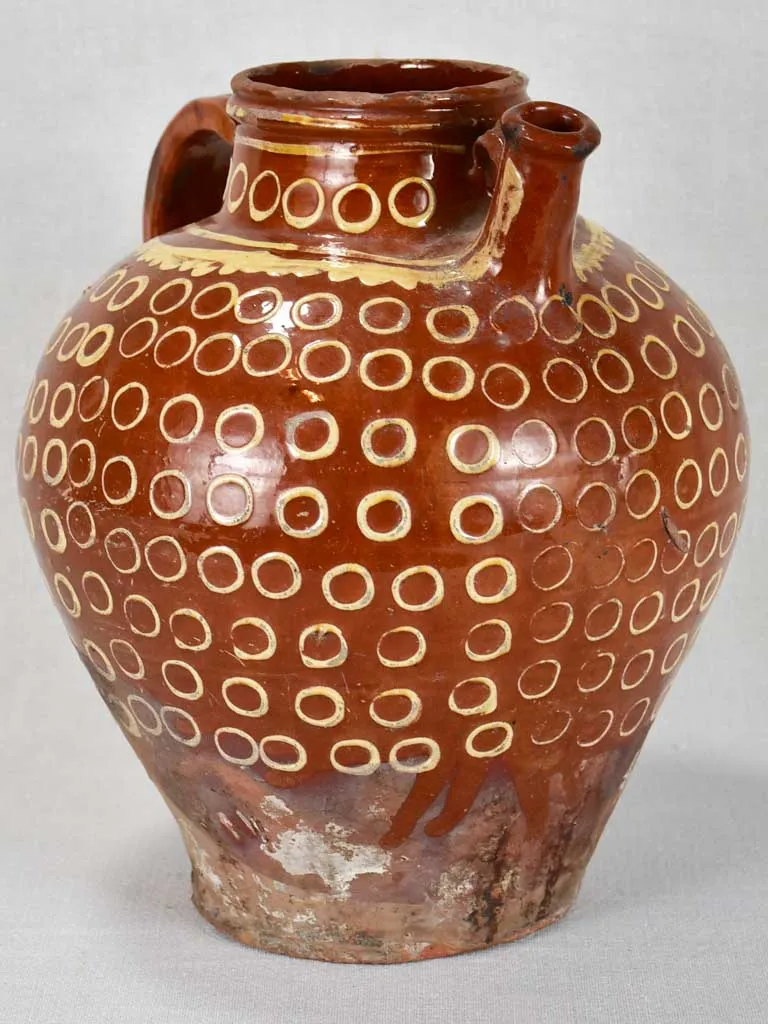 Late 19th century French water pitcher with brown glaze and beige spots