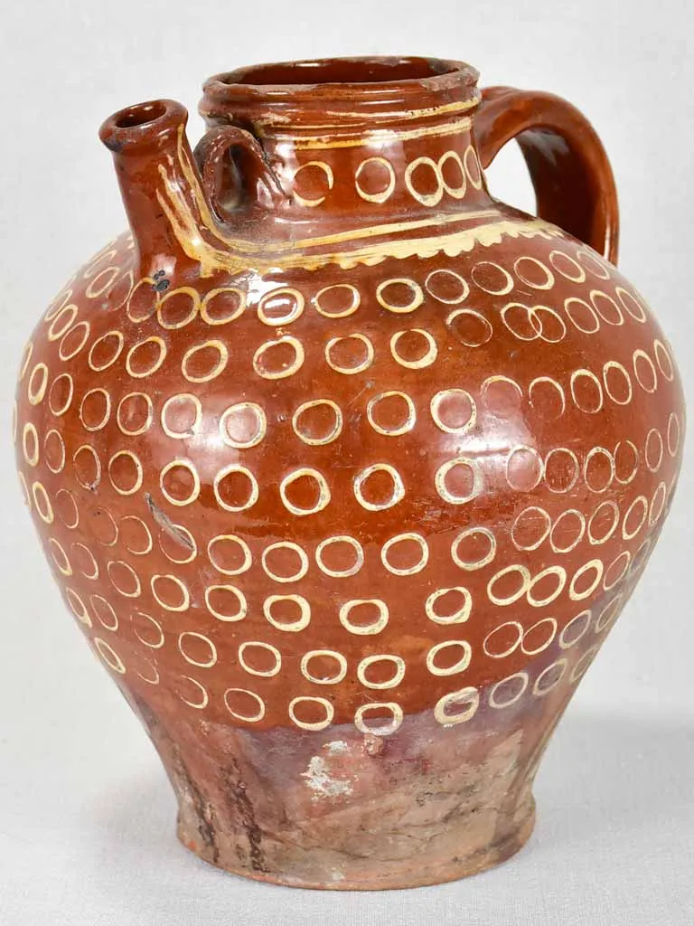 Late 19th century French water pitcher with brown glaze and beige spots